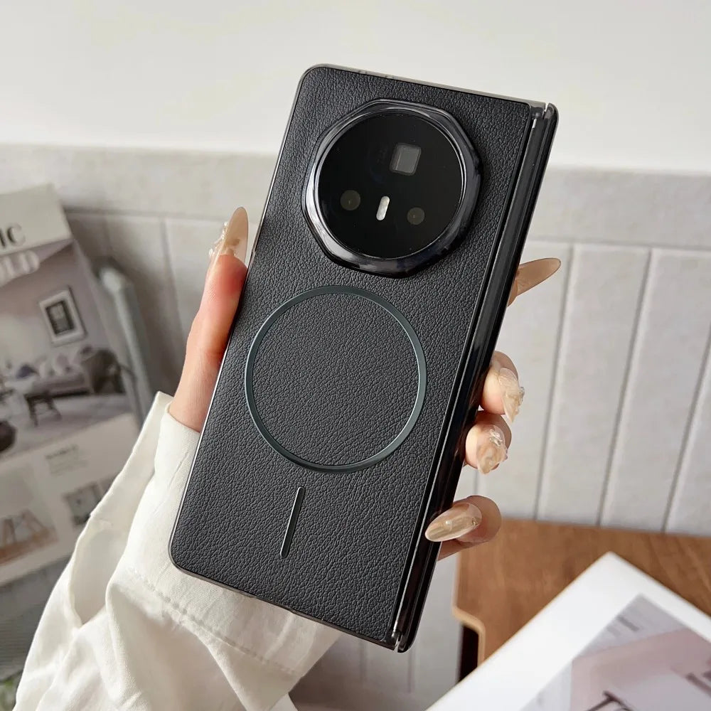 Person holding a black phone case with a textured finish