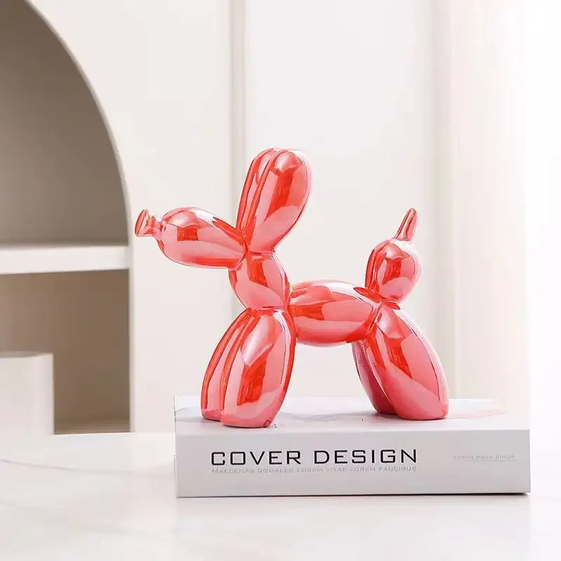 Red balloon dog sculpture on a white box with 'Cover Design' branding.