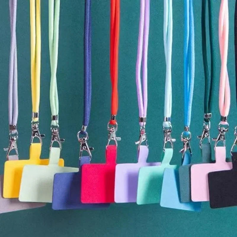 Colorful lanyards with badge holders on a green background