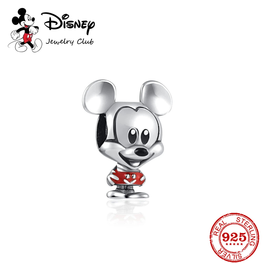 Silver Mickey Mouse charm with red shorts on a white background, featuring Disney Jewelry Club logo.