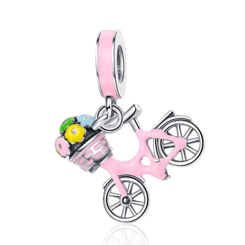Pink bicycle charm with basket and flowers on a white background pandora style