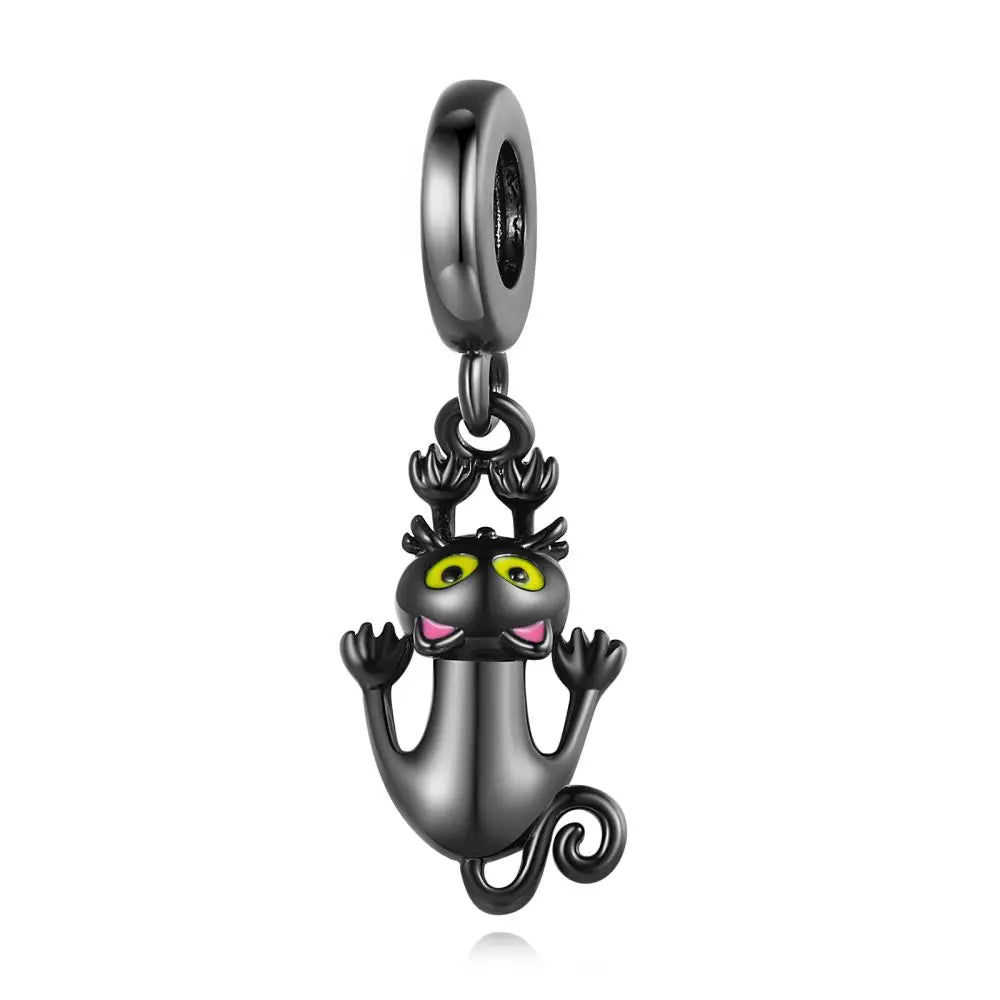 Black cat charm with green eyes and pink nose on a white background. pandora style charm pendant. Gothic style, halloween theme