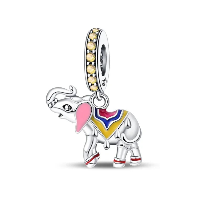 Silver elephant charm with colorful details on a white background