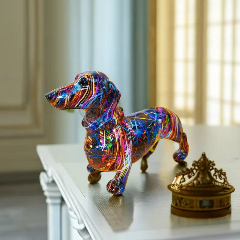 Colorful dog-shaped object on a white surface with a blurred background dashhound