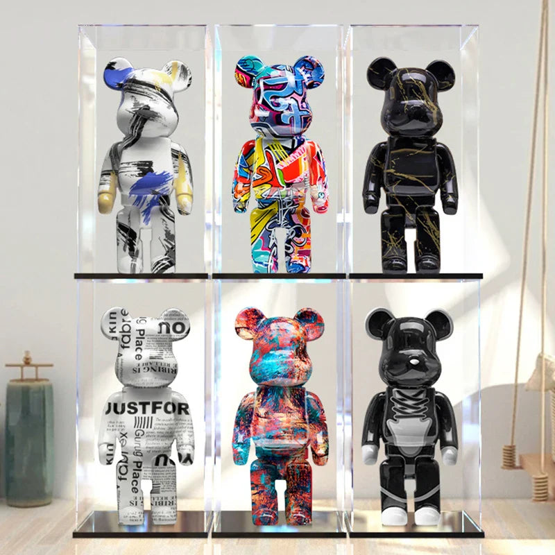 Six colorful bear figurines in a glass display case. be@rbrick collectable