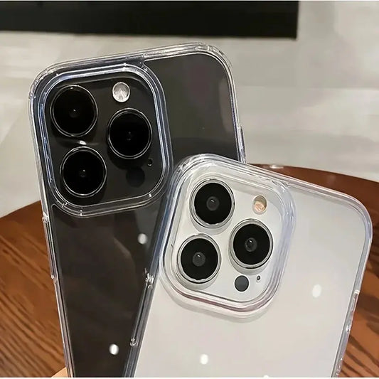 Two phone cases with camera lens designs on a wooden surface.