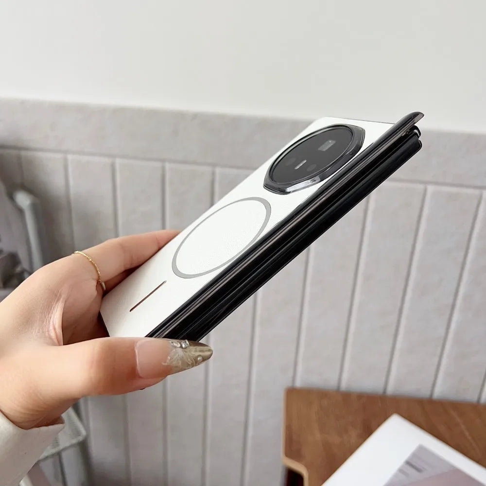Hand holding a smartphone with a white case against a light background