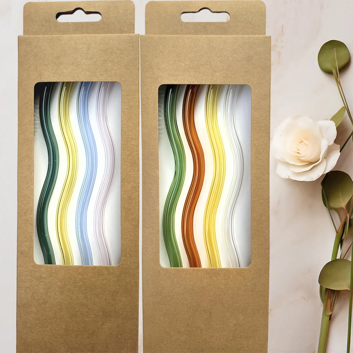 4Pcs Wavy Glass Straws Shatter-Resistant set in eco-friendly packaging with colorful straws visible through a window, ideal for kitchen and barware use.
