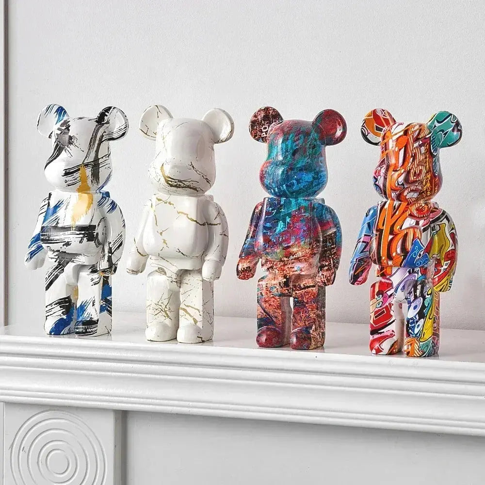 Four colorful bear figurines on a white surface with a light gray background be@rbrick collectable