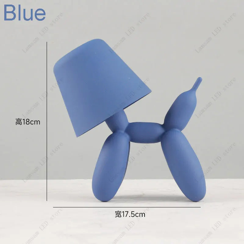 Blue balloon dog-shaped lamp with dimensions on a light gray background