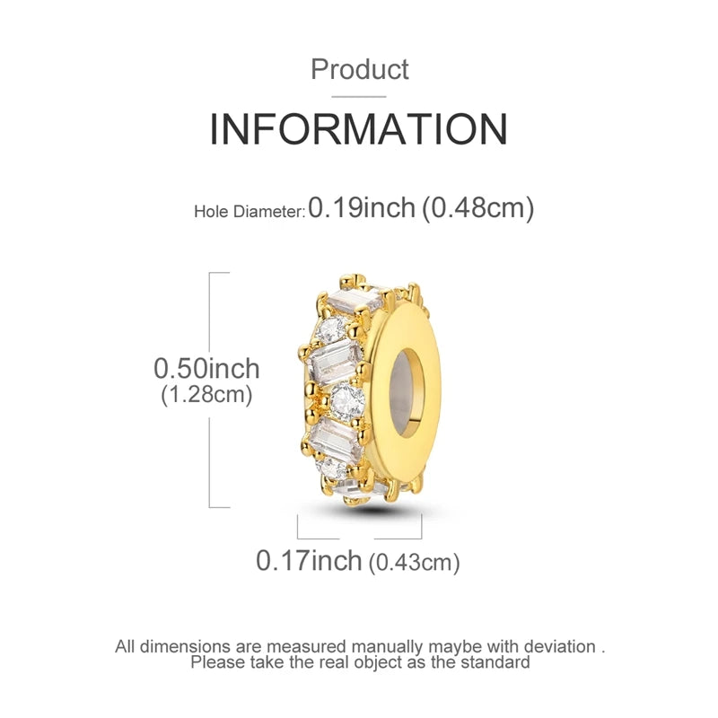 Gold charm with clear stones and measurements on a white background