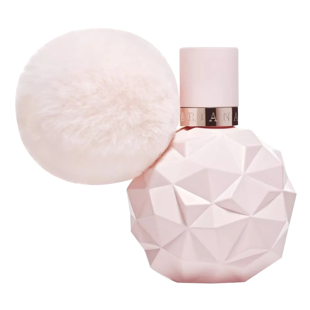 Adrian Grande Pink perfume bottle with geometric design and matching fluffy applicator on a white background