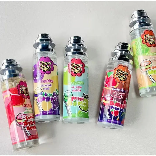 Collection of Chupa Chups body mist bottles on a white background