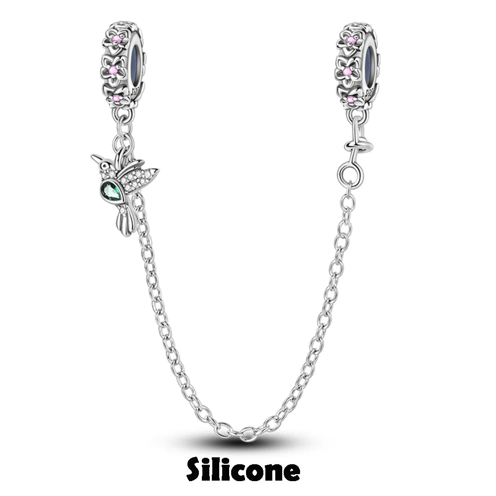 Jewelry set with two beaded charms and a chain on a white background, featuring the brand 'Silicone'.