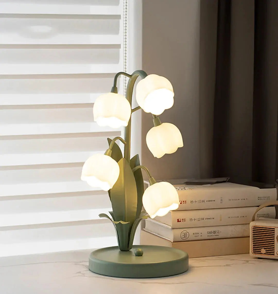 Decorative table lamp with multiple light bulbs on a surface.