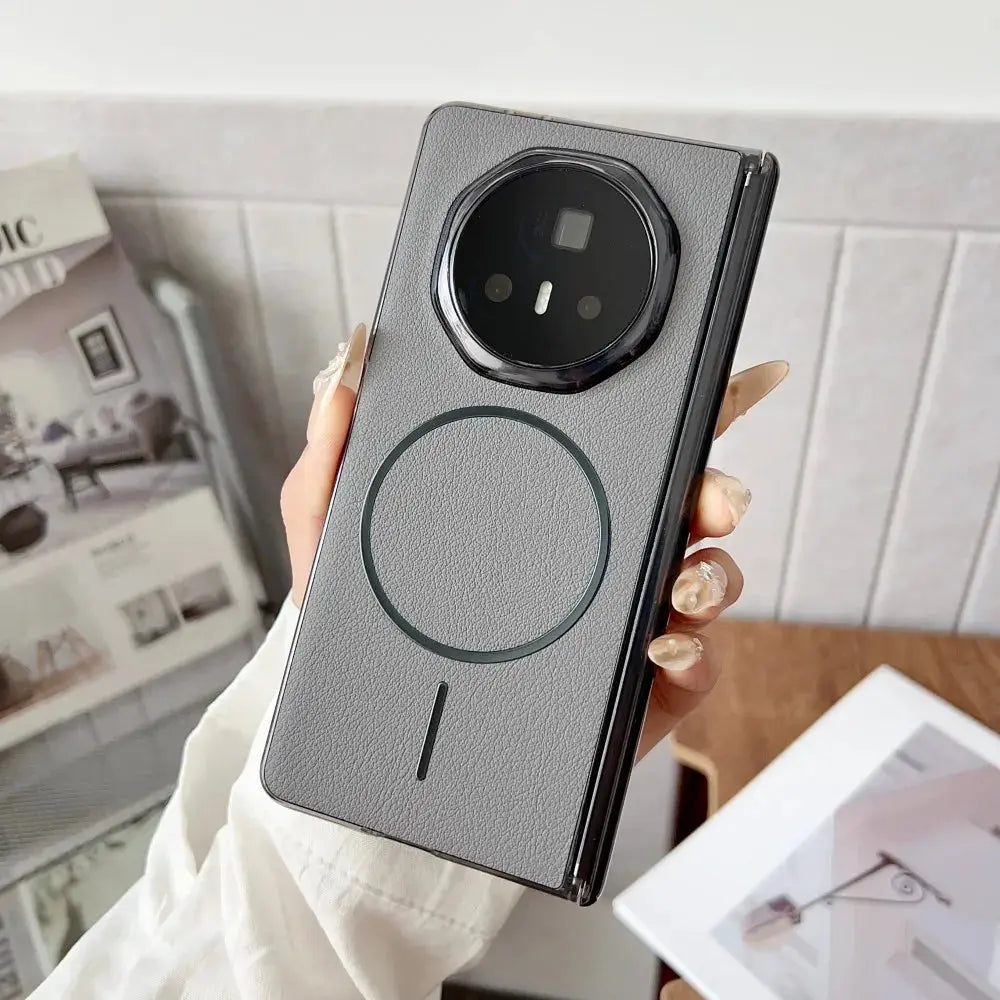 Person holding a modern phone case with a blurred indoor background
