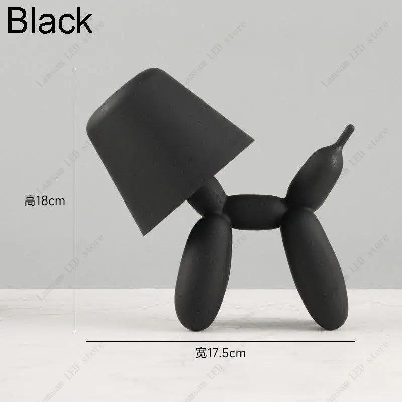 Black balloon dog sculpture with dimensions on a gray background