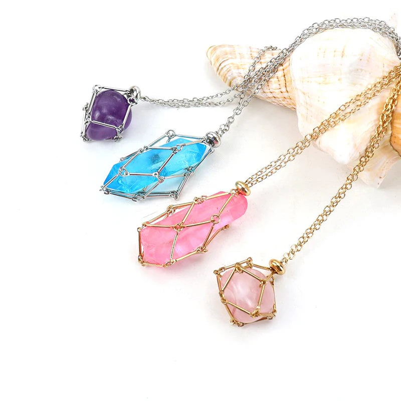 Colorful crystal pendants on chains with a shell in the background