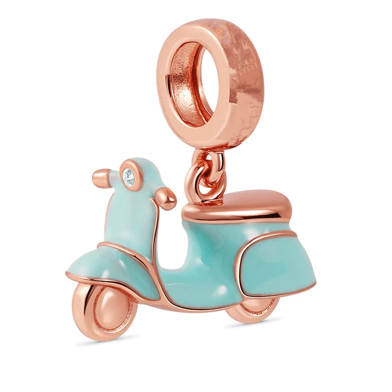 Jewelry charm shaped like a turquoise scooter with rose gold accents on a white background pandora style