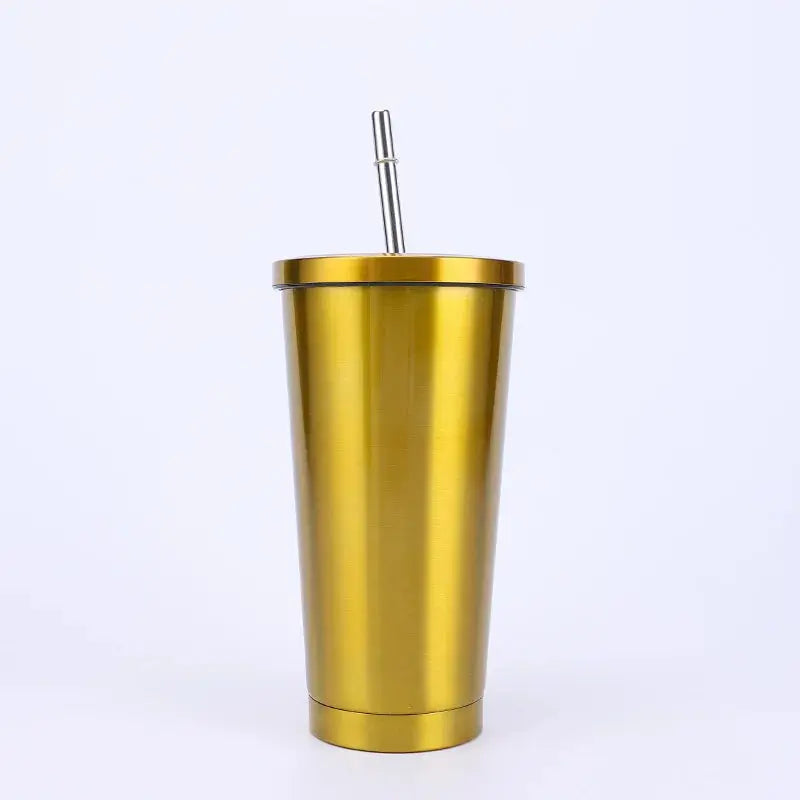 Gold metallic tumbler with a straw on a white background