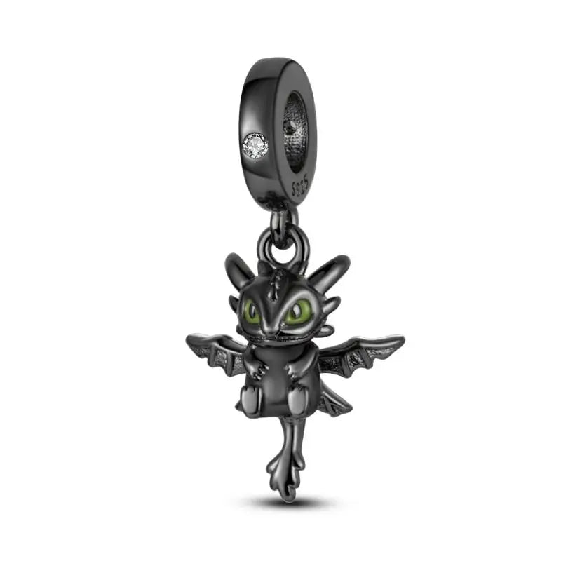 Black dragon-shaped charm with green eyes on a white background pandora style charm pendant. Gothic style, halloween theme t