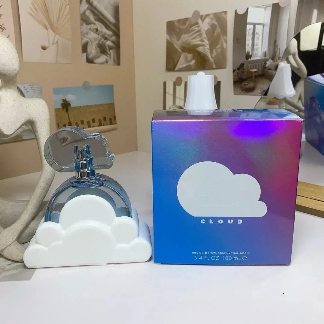 Perfume bottle and packaging with 'Cloud' branding on a surface.