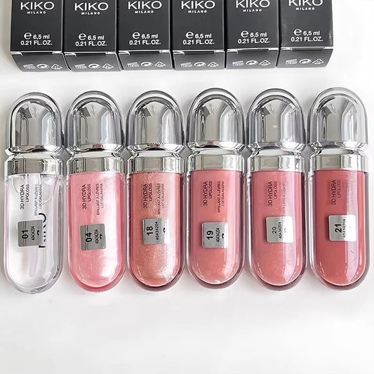Set of Kiko Milano lip glosses with clear and pink shades on a white background.