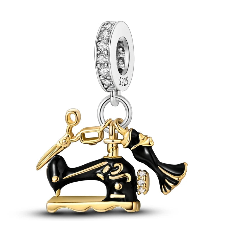 Jewellery charm with a sewing machine and scissors design on a white background pandora style charm pendant. Gothic style, halloween theme