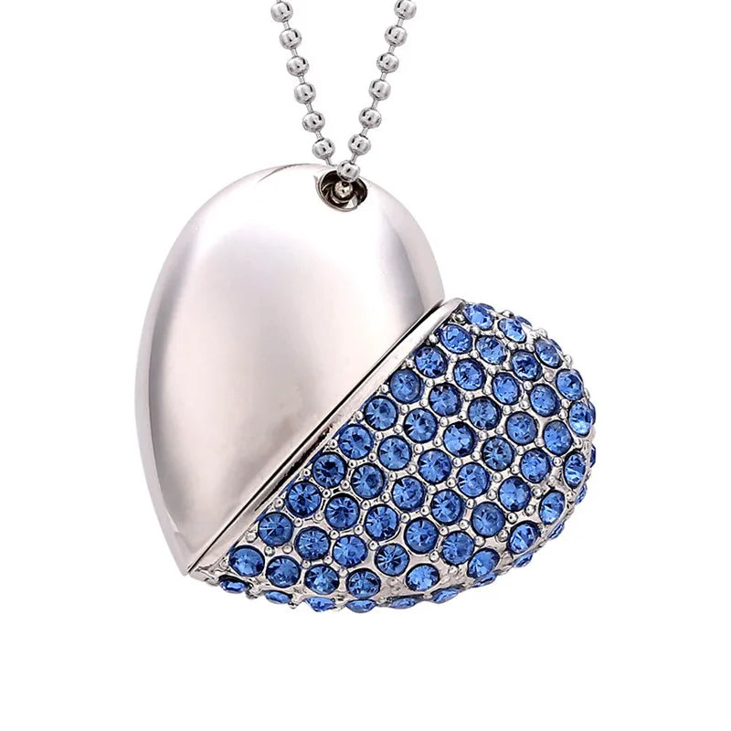 Heart-shaped pendant with blue gemstones on a white background