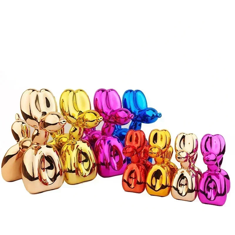 Colorful balloon dog sculptures in various metallic finishes on a white background