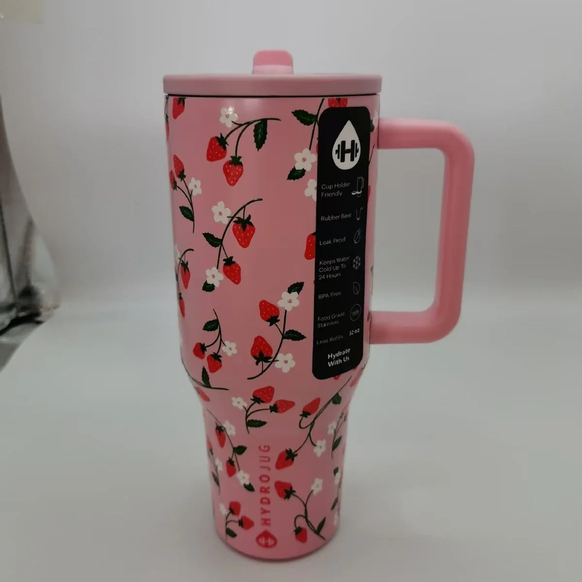 Strawberry print HydroJug Gobelet 40OZ Voyageur Thermos with pink handle, combining playful design with functional hydration.