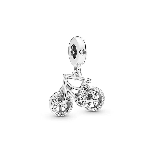 Silver bicycle charm with clear stones on a white background pandora style