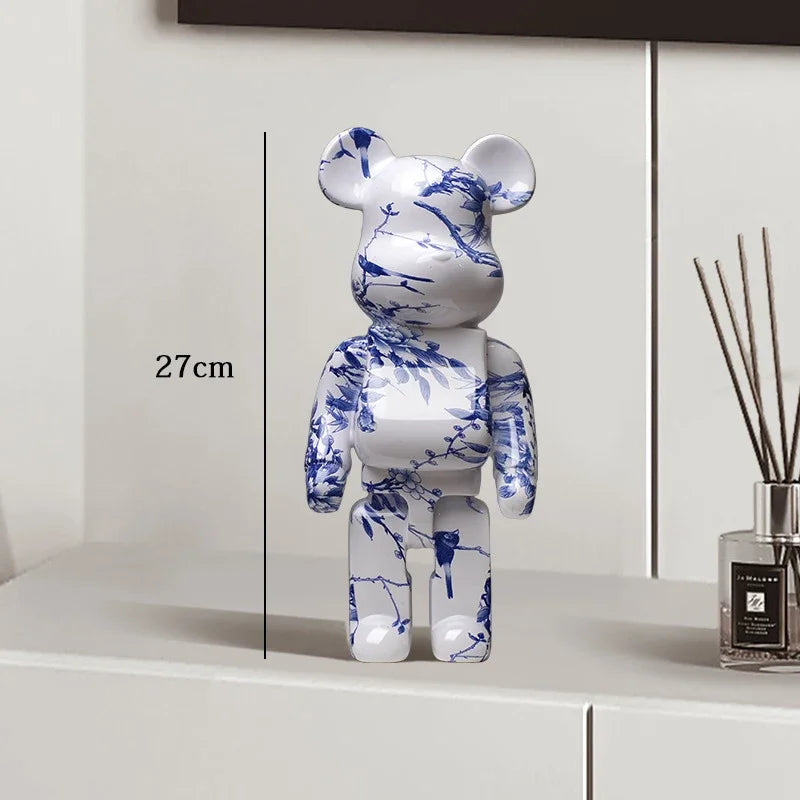 White bear figurine with blue floral patterns on a white surface, next to a diffuser. be@rbrick collectable