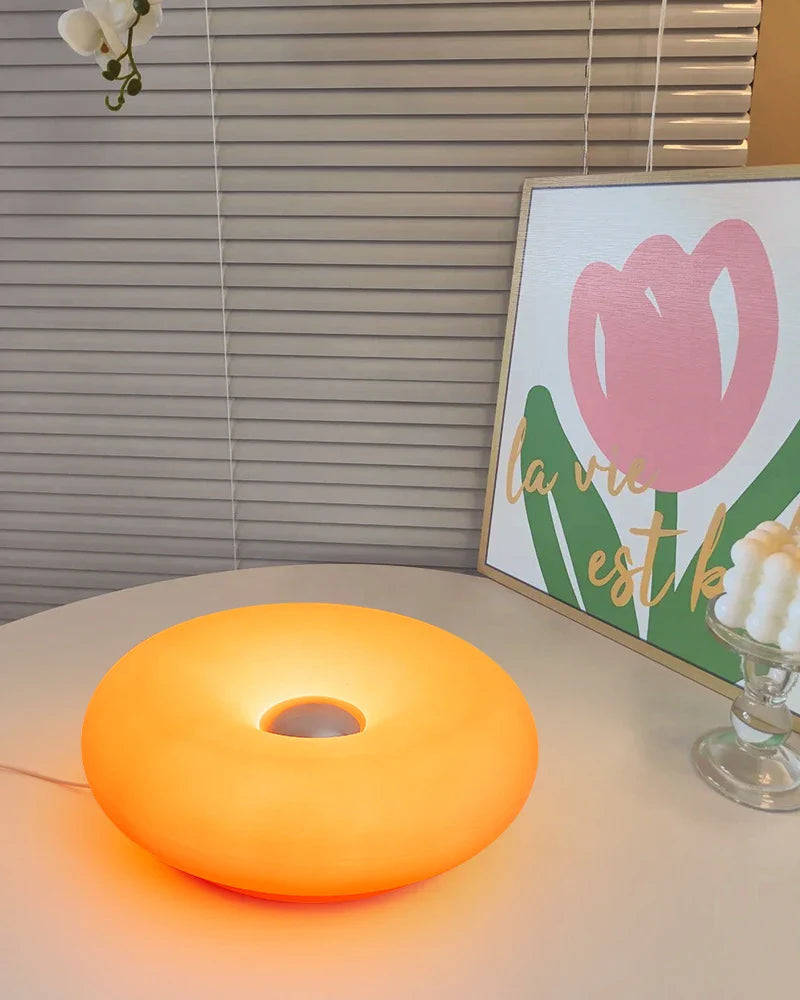 Orange lamp on a surface with a blurred background
