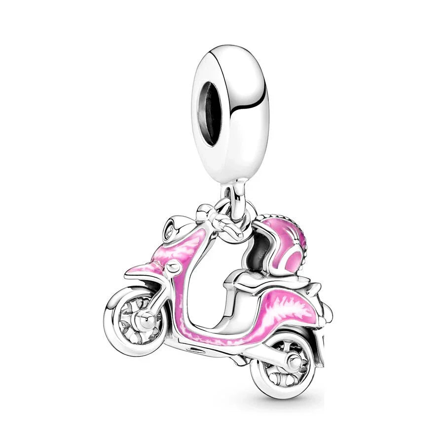 moped Motorcycle-shaped charm with pink details on a white background