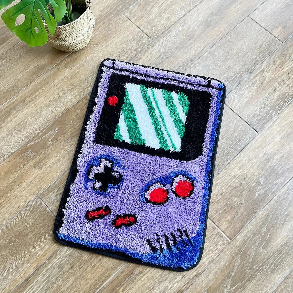 Decorative rug shaped like a vintage video game console on a wooden floor.