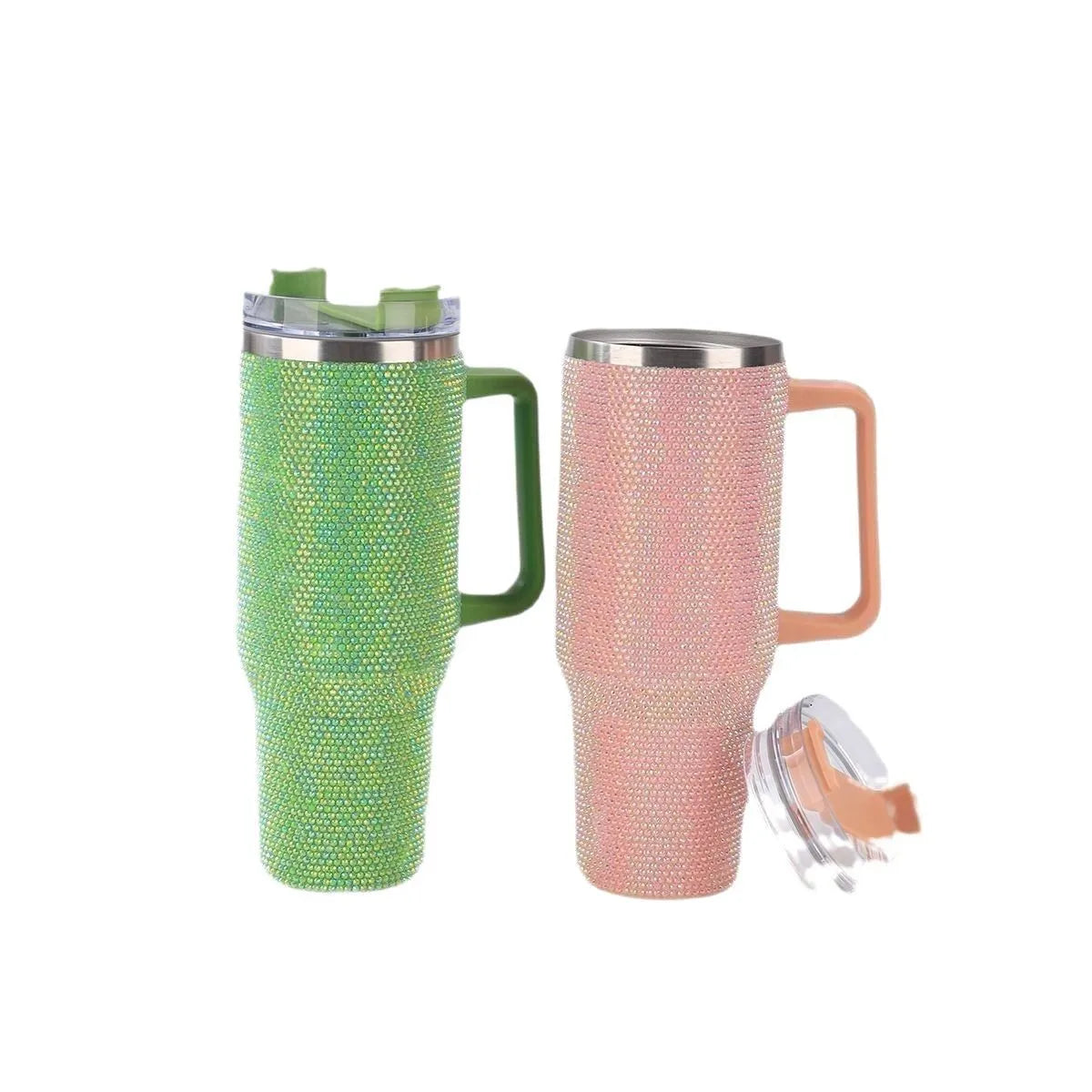 Two glittery travel mugs, one green and one pink, on a white background.