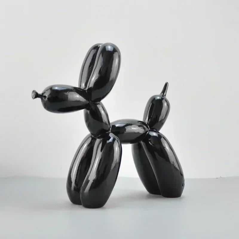 Black balloon dog sculpture on a white background