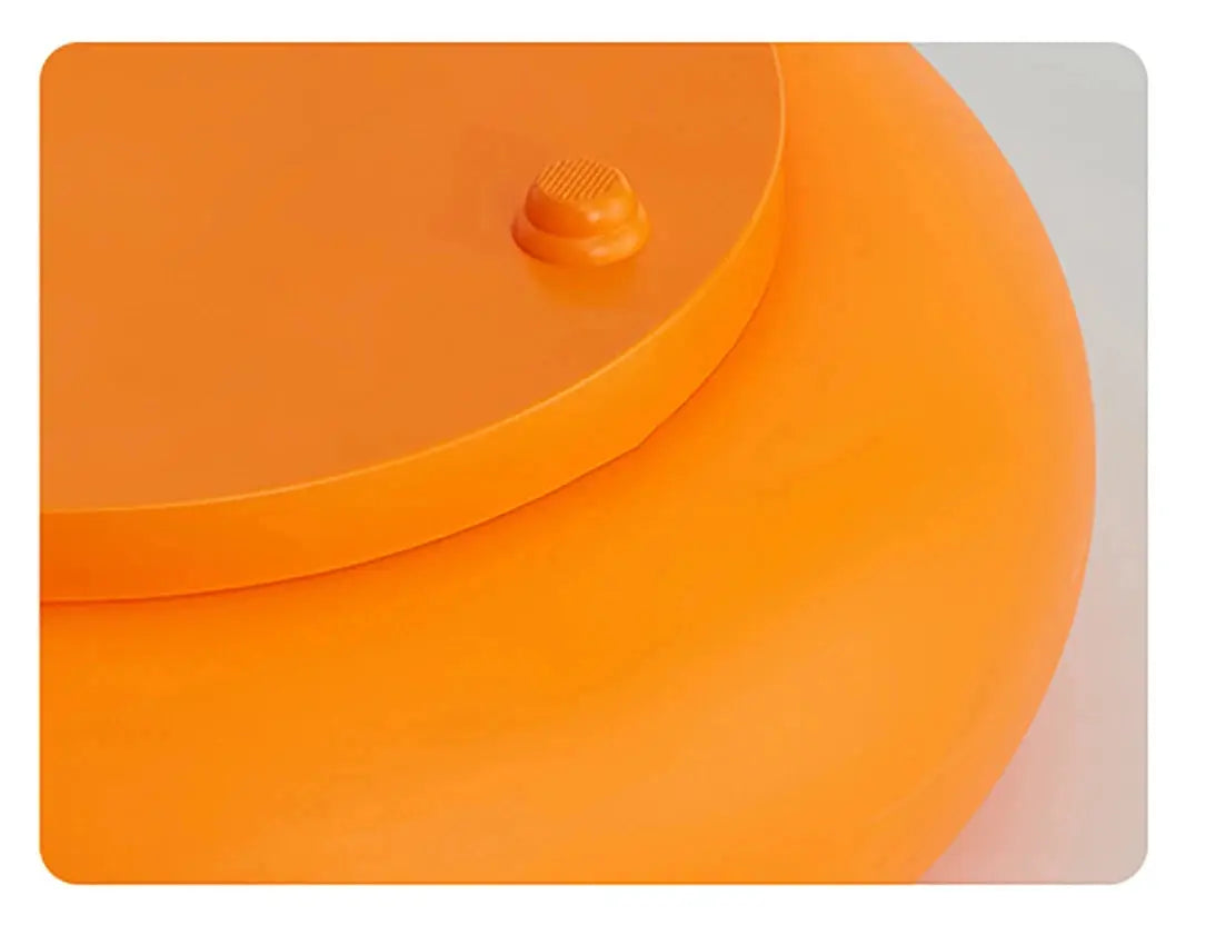 Orange silicone mat with a gray border on a white background