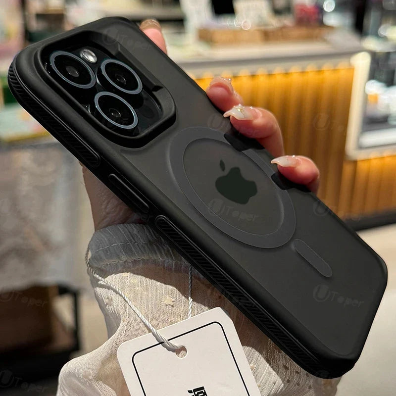Black phone case with Apple logo held by a person, blurred indoor background