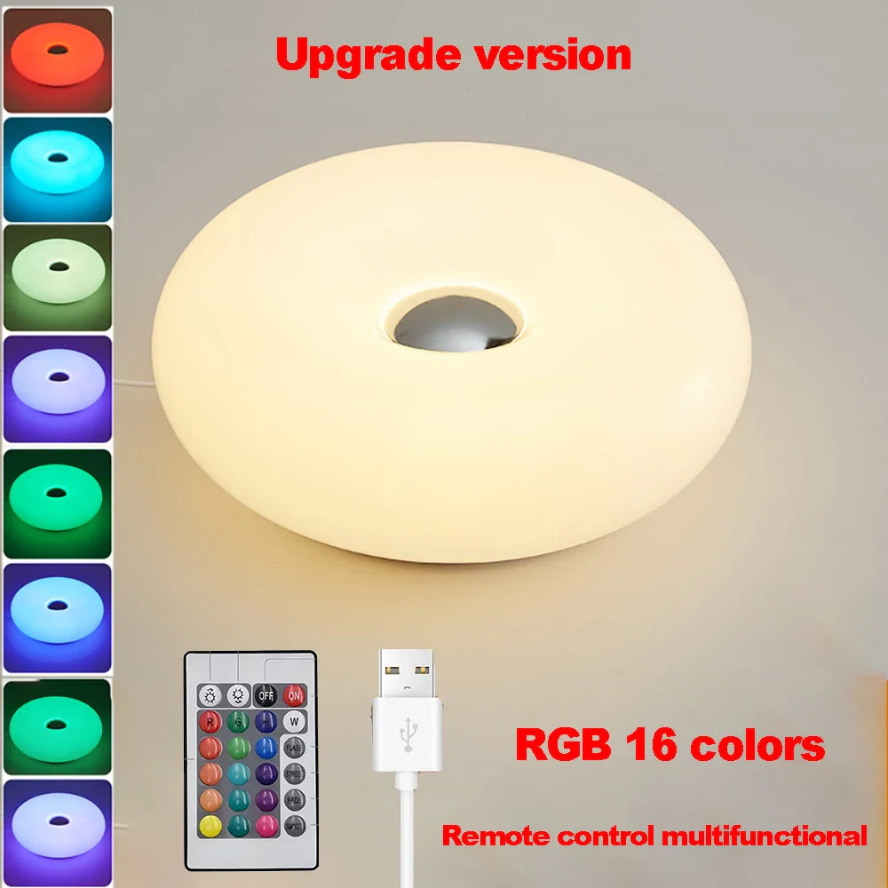 Ceiling light with RGB color options, remote control, and USB cable on a gray background