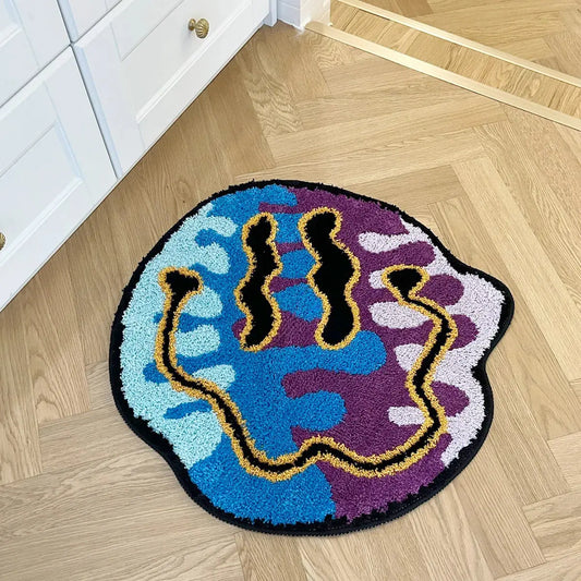 Colorful doormat with abstract design on a wooden floor