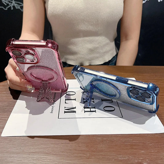 Pink and blue phone cases on a table with a person holding the pink case.