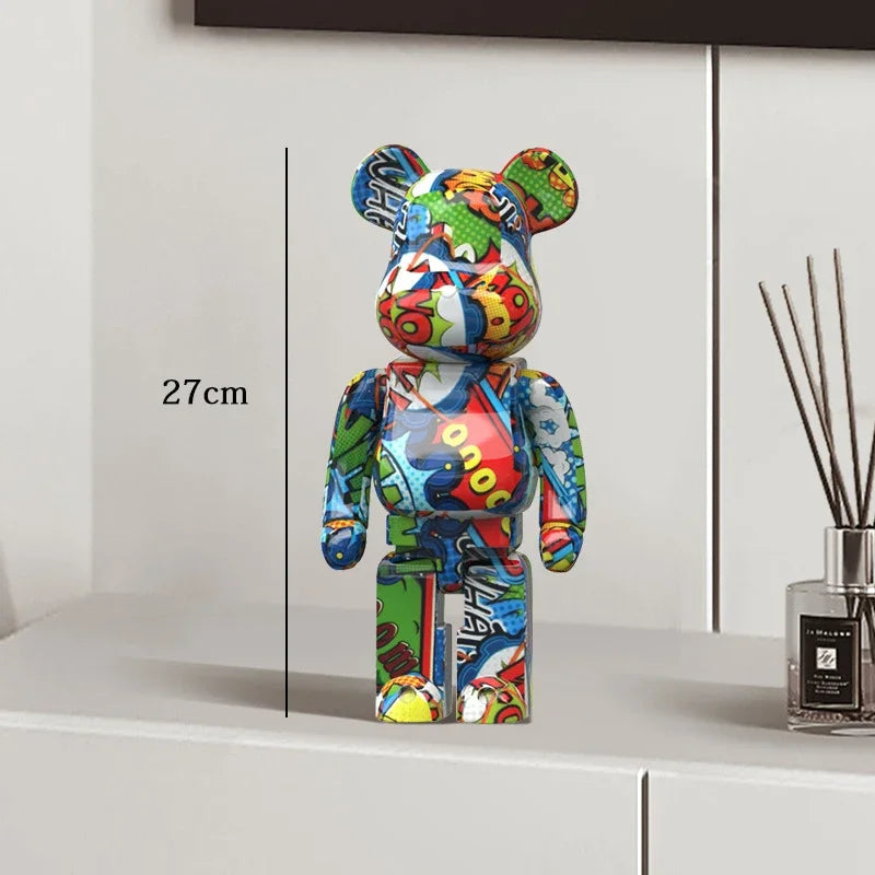 Colorful bear-shaped figure on a white surface with a diffuser in the background be@rbrick collectable