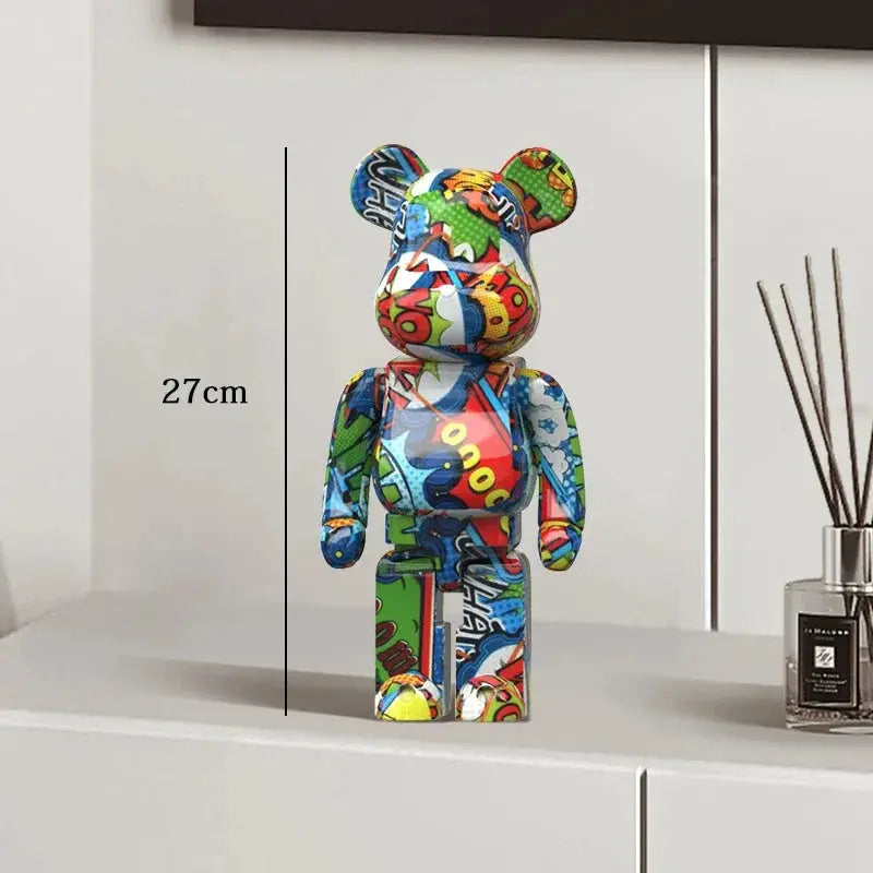 Colorful bear-shaped figure on a white surface with a diffuser in the background be@rbrick collectable
