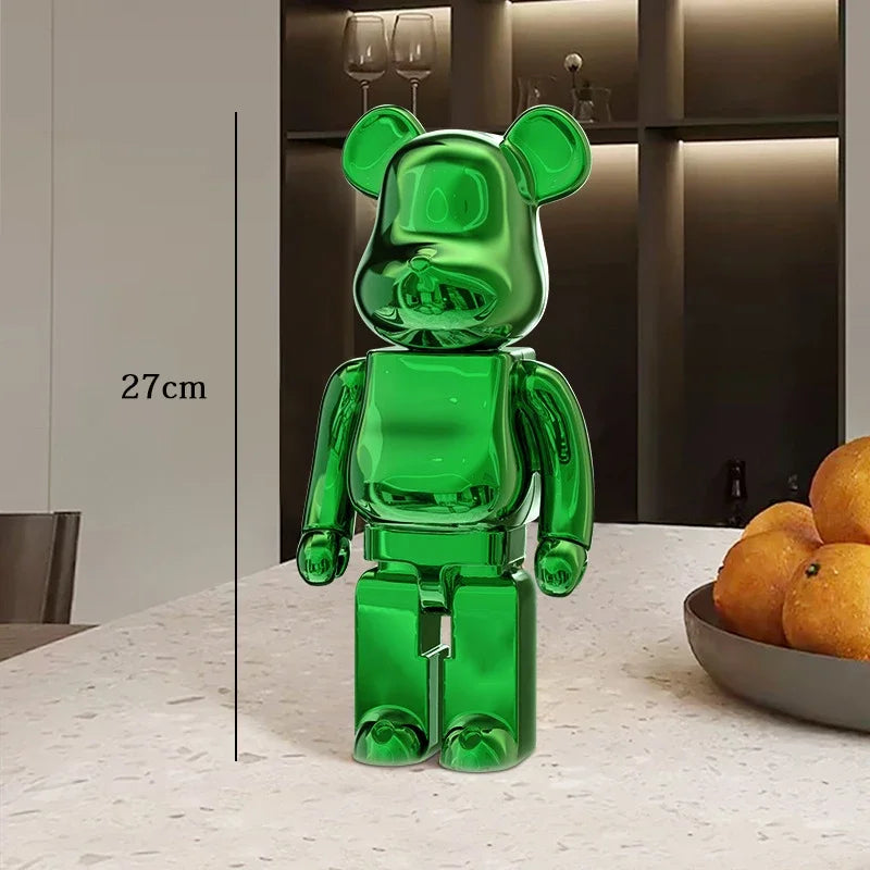 Green transparent bear-like figure on a table with a measurement label, indoor setting. be@rbrick collectable