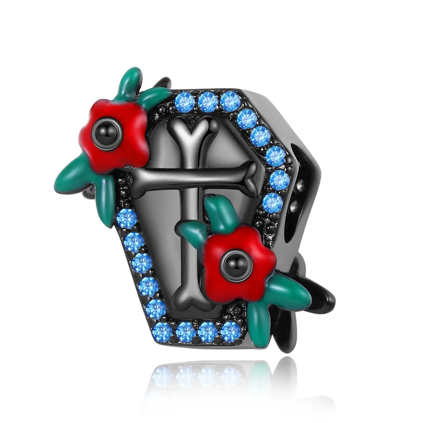 Decorative brooch with red flowers, green leaves, and blue gemstones on a white background, coffin pandora style charm pendant. Gothic style, halloween theme