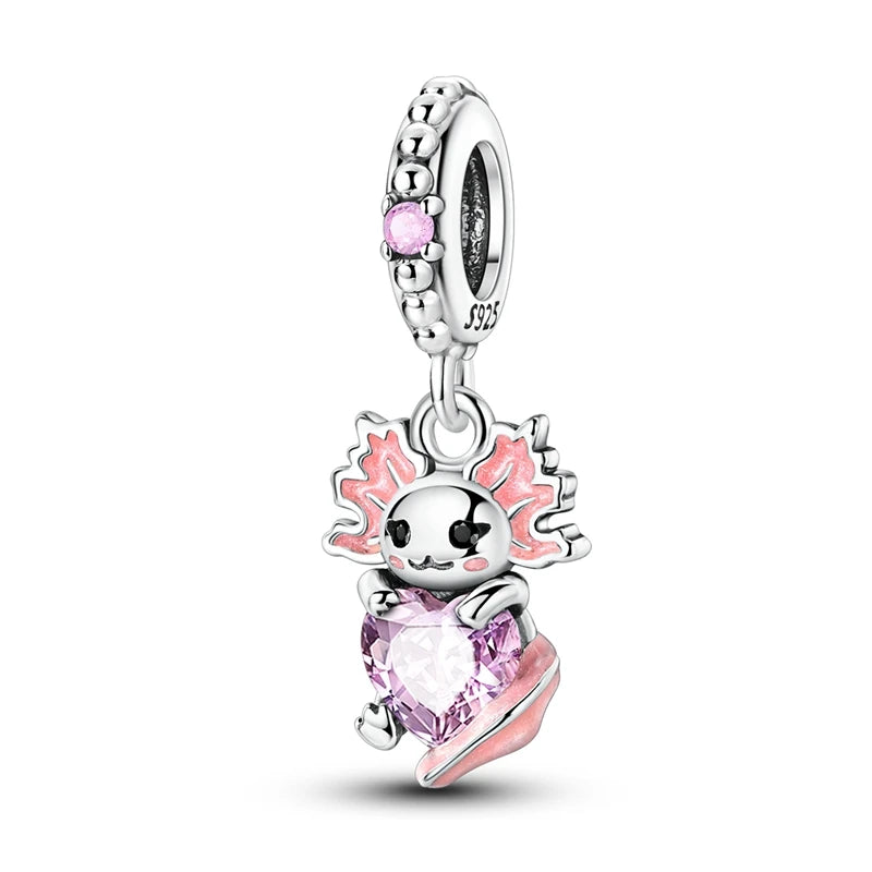 Silver charm with pink accents on a white background