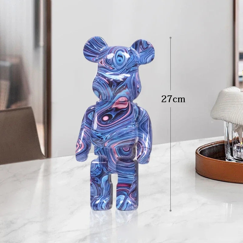 Marbled blue and pink bear figurine on a white surface with a measurement label indicating 27cm. be@rbrick collectable