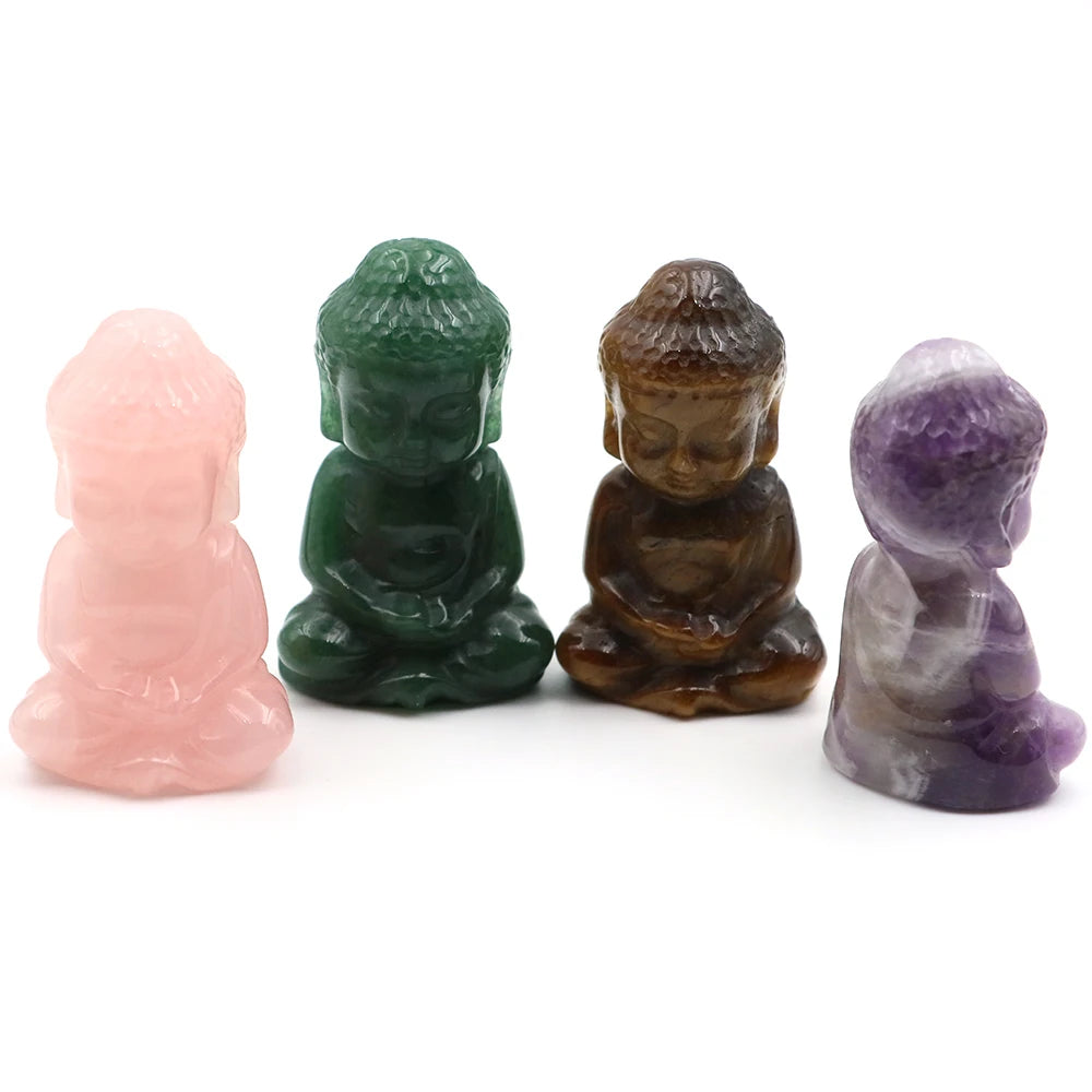 Four colorful crystal Buddha figurines on a white background